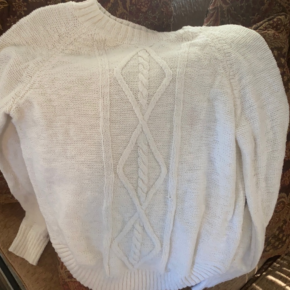 White women’s sweater.
